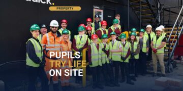 Students trying bricklaying at Caddick's SOYO site, building Leeds construction skills