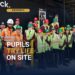 Students trying bricklaying at Caddick's SOYO site, building Leeds construction skills